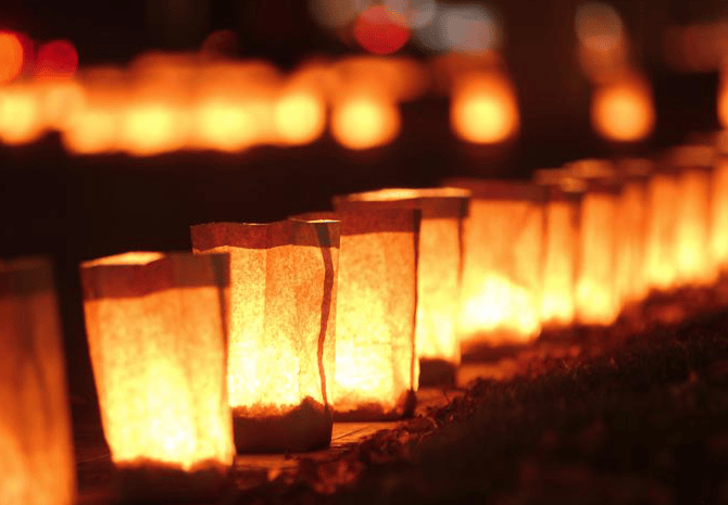 Paper bags with candles called luminaries